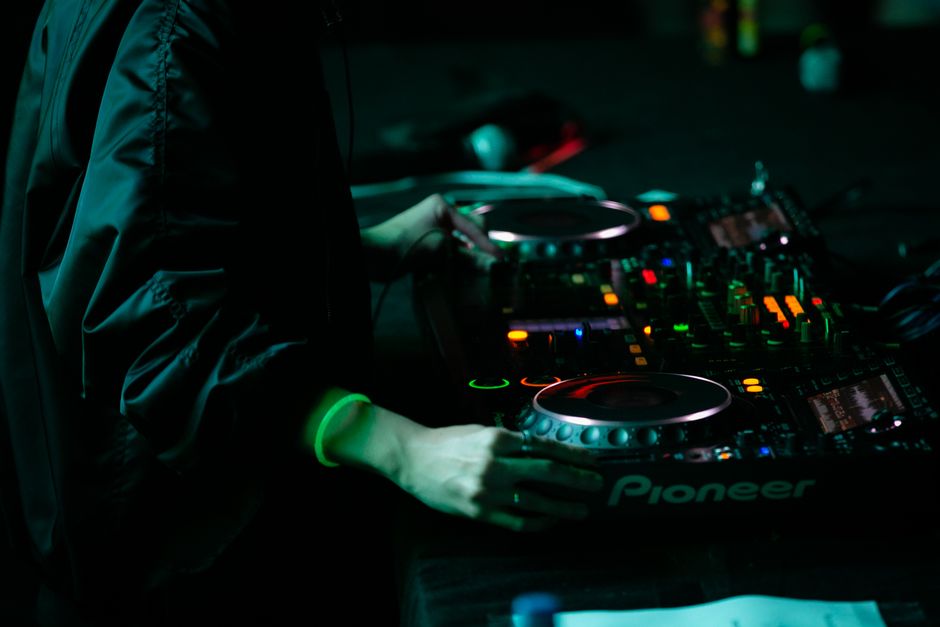 DJ booth setup with mixer and controller ready for a club set
